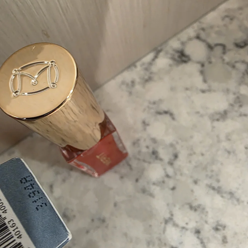 Merit Shade Slick Gelée Tinted Lip Oil in the shade 
